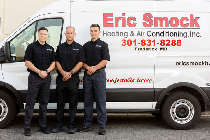 Eric Smock team members in front of service truck